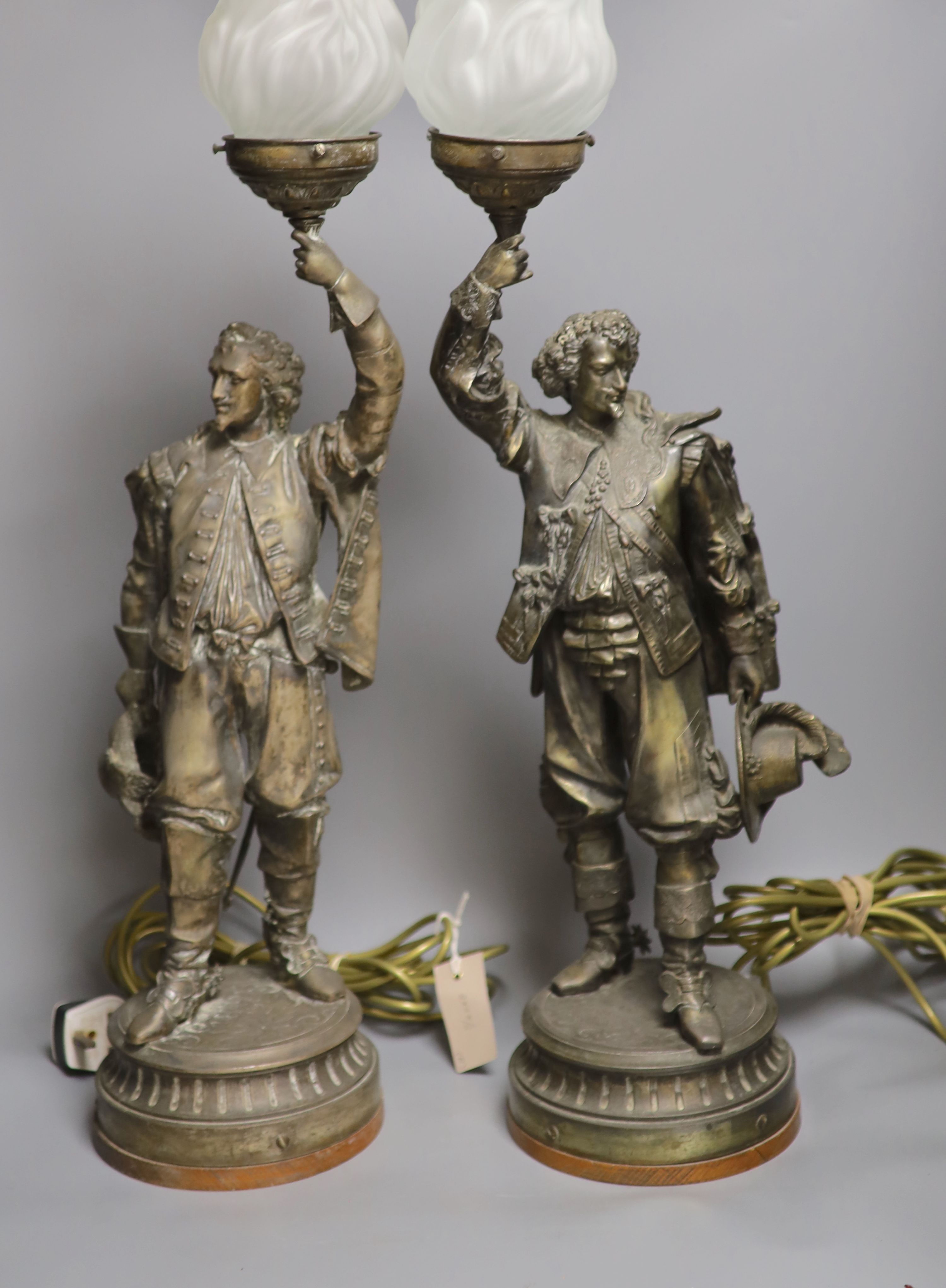 A pair of patinated spelter ’cavalier’ table lamps, early 20th century, 76 cm